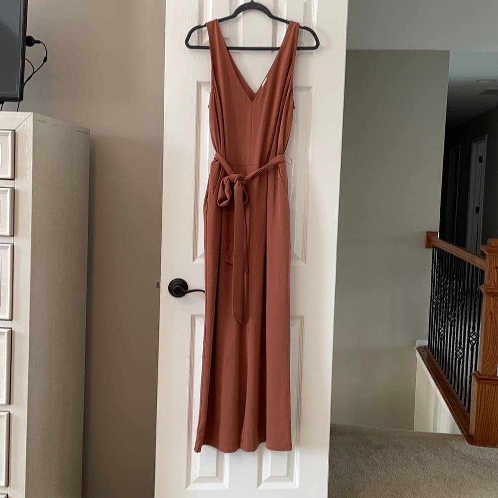 A new day. Large rust colored jumpsuit